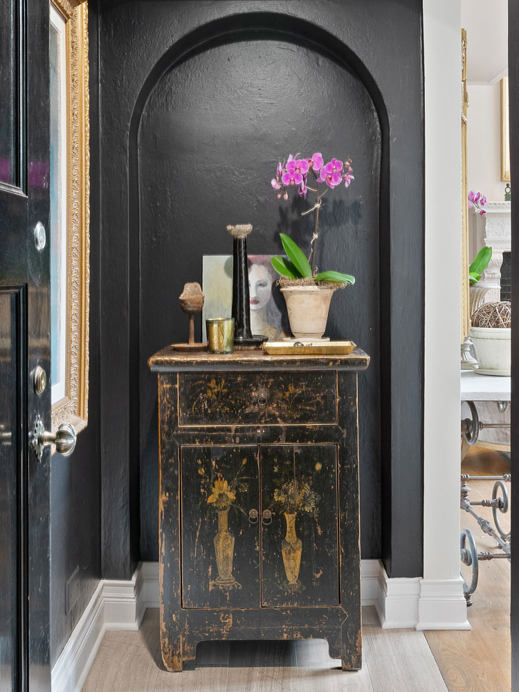 Marti Napolitano Interiors project photo featuring a vintage cabinet and decor.