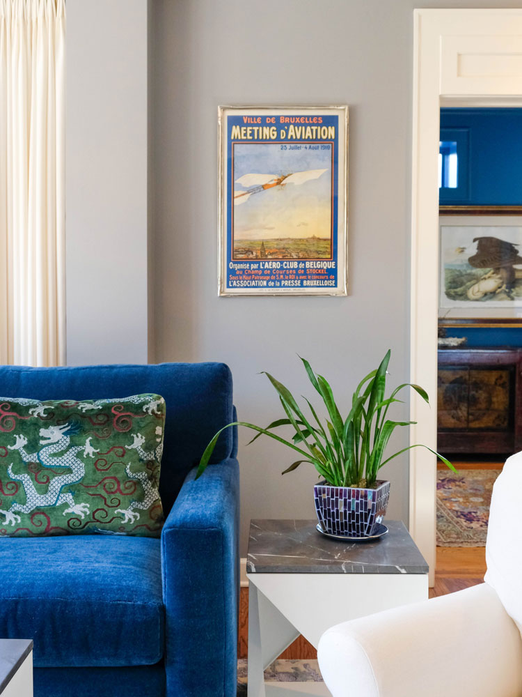 Marti Napolitano Interiors living room project photo. featuring a coach, end-table, and wall art.