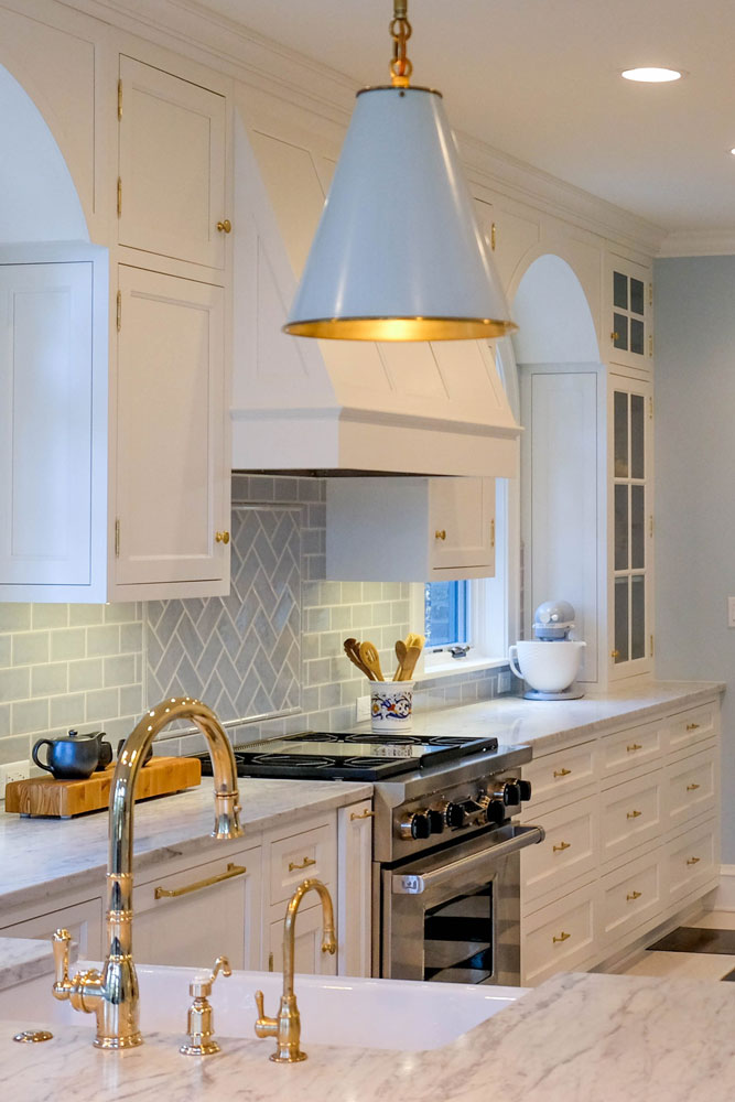 Marti Napolitano Interiors kitchen project photo featuring a range, sink, and cupboards.